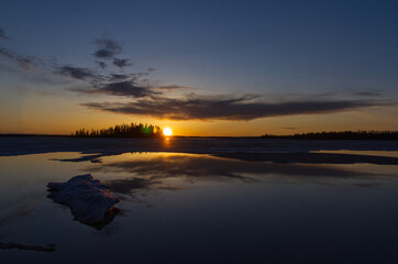 Naklejka na ściany i meble Beautiful Sunset over a Partially Frozen Astotin Lake
