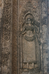 Fototapeta na wymiar Sandstone sculpture of Apsara at Pre Rup Castle, an ancient castle in Siem Reap, Cambodia.