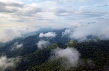 Aerial view Beautiful  panorama of morning scenery Golden light sunrise And the mist flows on high mountains forest. Pang Puai, Mae Moh, Lampang, Thailand.	