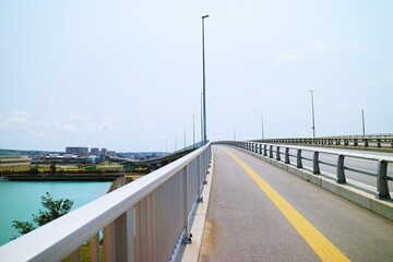 View from a bridge across a river without a car, cityscape