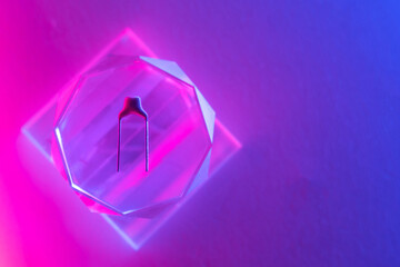 Blurred background with electronic component, neon lighting, copy space. Disadvantage of semiconductors.