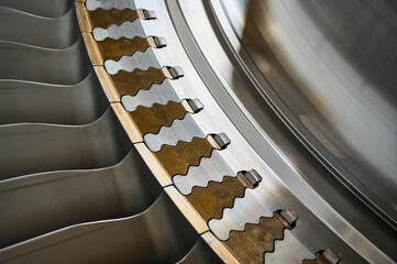 The rotor blades of a modern turbine, a close-up shot of the roots of long blades