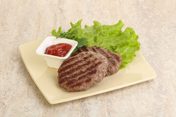 Grilled beef burger cutlet with sauce