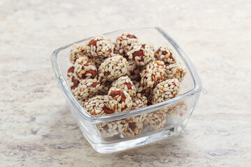 Sweet peanut in sesame seeds