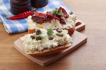 bruschetta with soft cheese capers and tomato