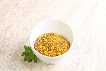 Grain mustard sauce in the bowl