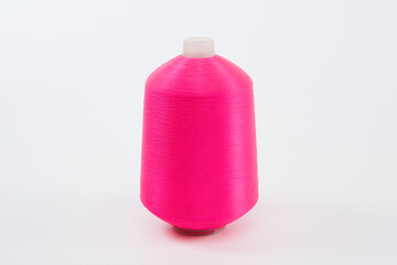 Pink of yarn bobbins, spool sewing on the white background.
