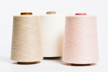 Fototapeta na wymiar Linen and silk yarn bobbins