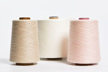 Fototapeta na wymiar Linen and silk yarn bobbins