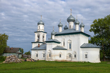 Fototapeta na wymiar Ancient Church of the Nativity of the Virgin (1680) on a cloudy August morning. Kargopol, Russia