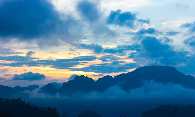 Fototapeta na wymiar sunrise over the mountains cloud and fog