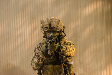 Soldiers practicing gun shooting see the barrel of a gun. Selective focus.