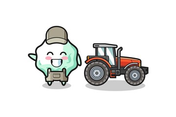 the chewing gum farmer mascot standing beside a tractor