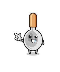 cooking spoon mascot pointing top left