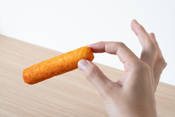 hand holding snuck stick