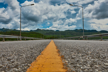 An ant perspective view looking to the mountain and clear blue sky.