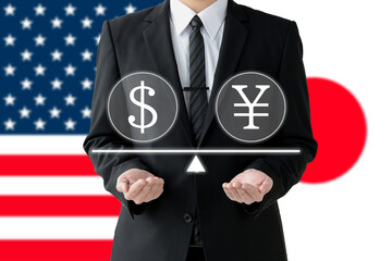 円マークとドルマークを掲げたビジネスマン・投資家