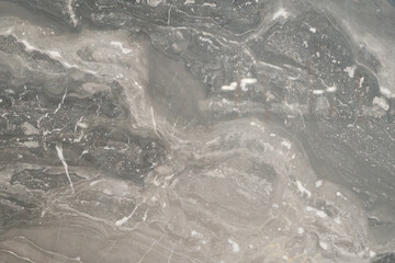 Close up of stone slab shows beautiful natural mineral pattern that perhaps flowed in Paleolithic period, resulted in stunning graphic in various forms under the crust. Unique in characters are formed