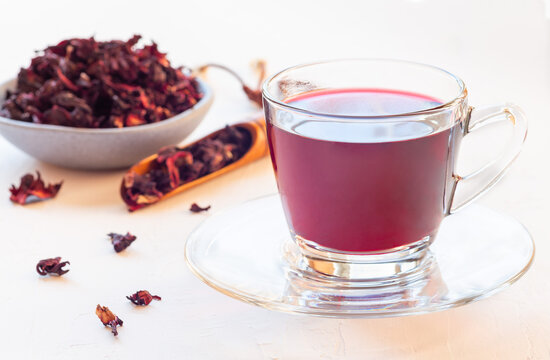 Red tea karkade or hibiscus in glass cup, horizontal