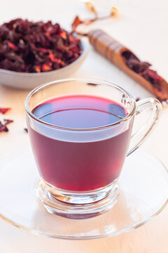 Red tea karkade or hibiscus in glass cup, vertical
