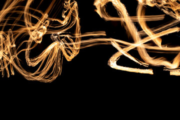 Circles of flames in dark. Fire show on long camera shutter speed. Flames.