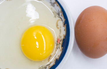 whole eggs and broken isolated on white background,