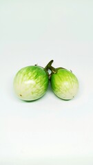 Close thai green eggplant isolation on white background. Round green vegetables are used as raw materials for cooking.