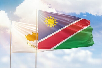 Sunny blue sky and flags of namibia and cyprus