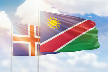 Sunny blue sky and flags of namibia and iceland