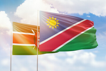 Sunny blue sky and flags of namibia and kenya