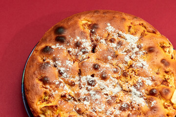 Homemade apple pie on a red background