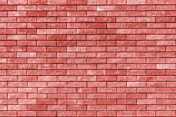 Red wall of the building. Designer building background.