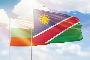 Sunny blue sky and flags of namibia and bulgaria