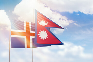 Sunny blue sky and flags of nepal and iceland