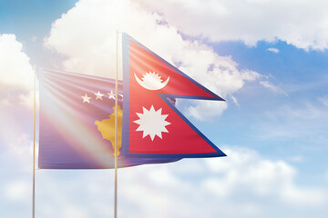 Sunny blue sky and flags of nepal and kosovo