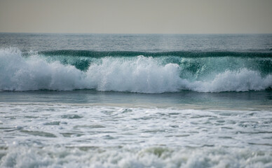 Sea foam. Beautiful landscape of sea and tropical beach. Travel and vacation, copy space. Panorama of the sea landscape, sunrise in the ocean. Panoramic view calm ocean. Beautiful serene scene.