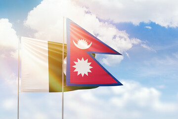 Sunny blue sky and flags of nepal and pakistan