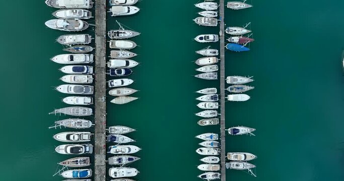 Aerial view of the yacht club. Aerial top-down view of docked sailboats. Top down view of yachts. Corfu