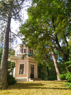 Pink Pavilion on Island of Anti Circe in National dendrological park Sofiyivka, Uman, Ukraine at sunny summer day.