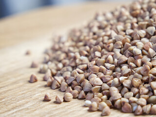 A bunch of buckwheat, side view. Buckwheat macro. Buckwheat for porridge.