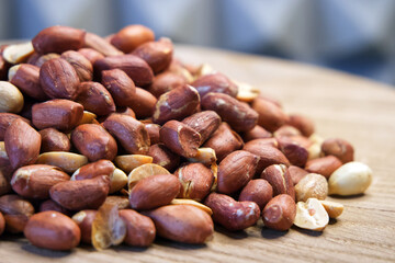Heap of roasted peanuts, side view. Peanuts macro. Spanish Peanuts in pile