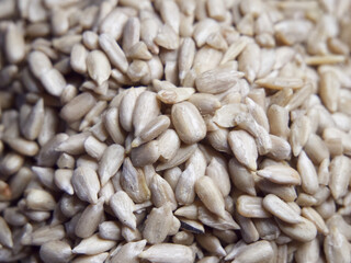 Lots of peeled sunflower seeds close-up. Heap of sunflower seeds, full frame.