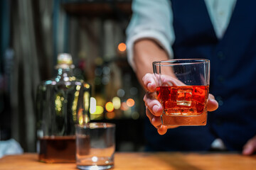 Bartender Serve Whiskey, on wood bar, 