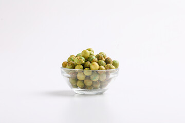 Indian snack, dry spicy green pea in glass bowl.