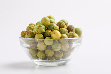 Indian snack, dry spicy green pea in glass bowl.