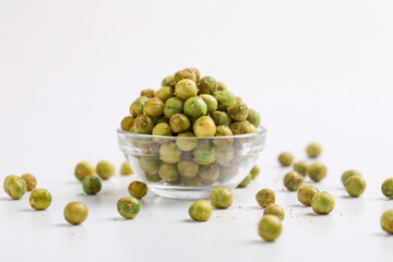 Indian snack, dry spicy green pea in glass bowl.