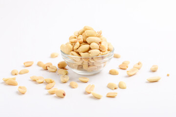 Salty peanuts in glass bowl on white background. Indian snack