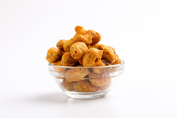 Roasted coated peanuts on white background. Delicious snack peanut.