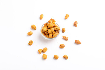 Roasted coated peanuts on white background. Delicious snack peanut.