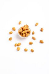 Fried coated peanuts on white background. Delicious snack peanut.